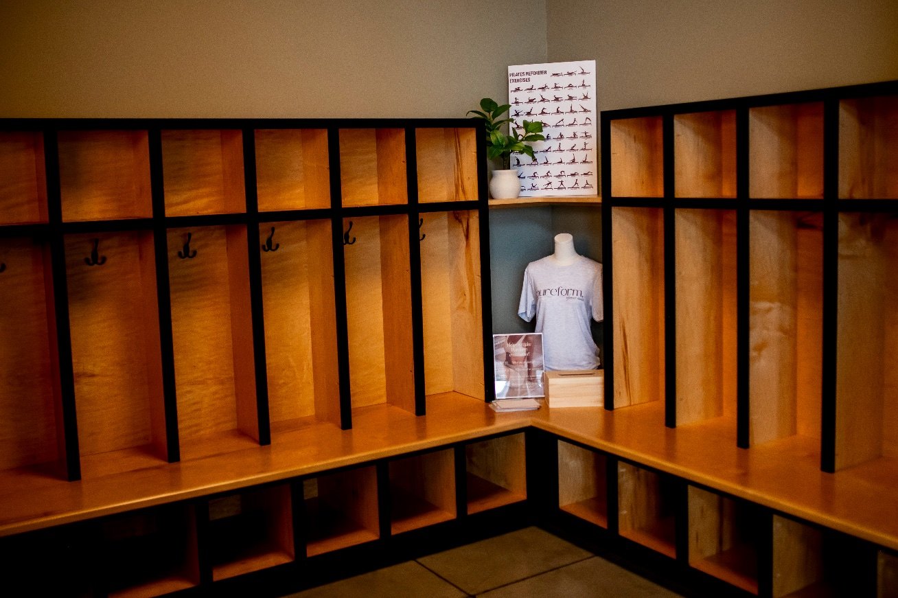 Wooden cubbies and benches in PureForm’s changing area